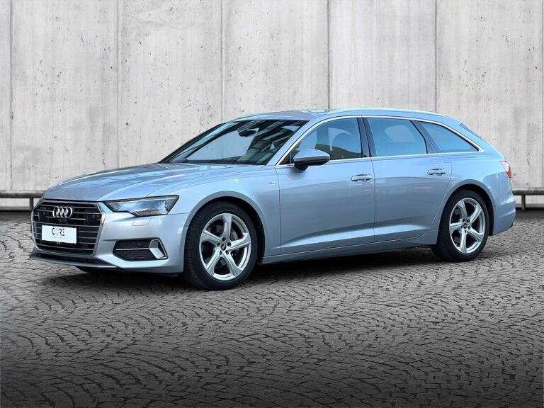 Sølvmetal Audi A6 TFSi Avant quattro S-tr. fra 2021 parkeret foran en betonmur. CORE Leasing A/S er eksperter i Audi leasing.