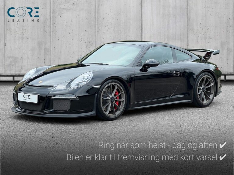 Sortmetal Porsche 911 GT3 Coupé PDK fra 2015 parkeret foran en betonmur. CORE Leasing A/S er eksperter i Porsche leasing.