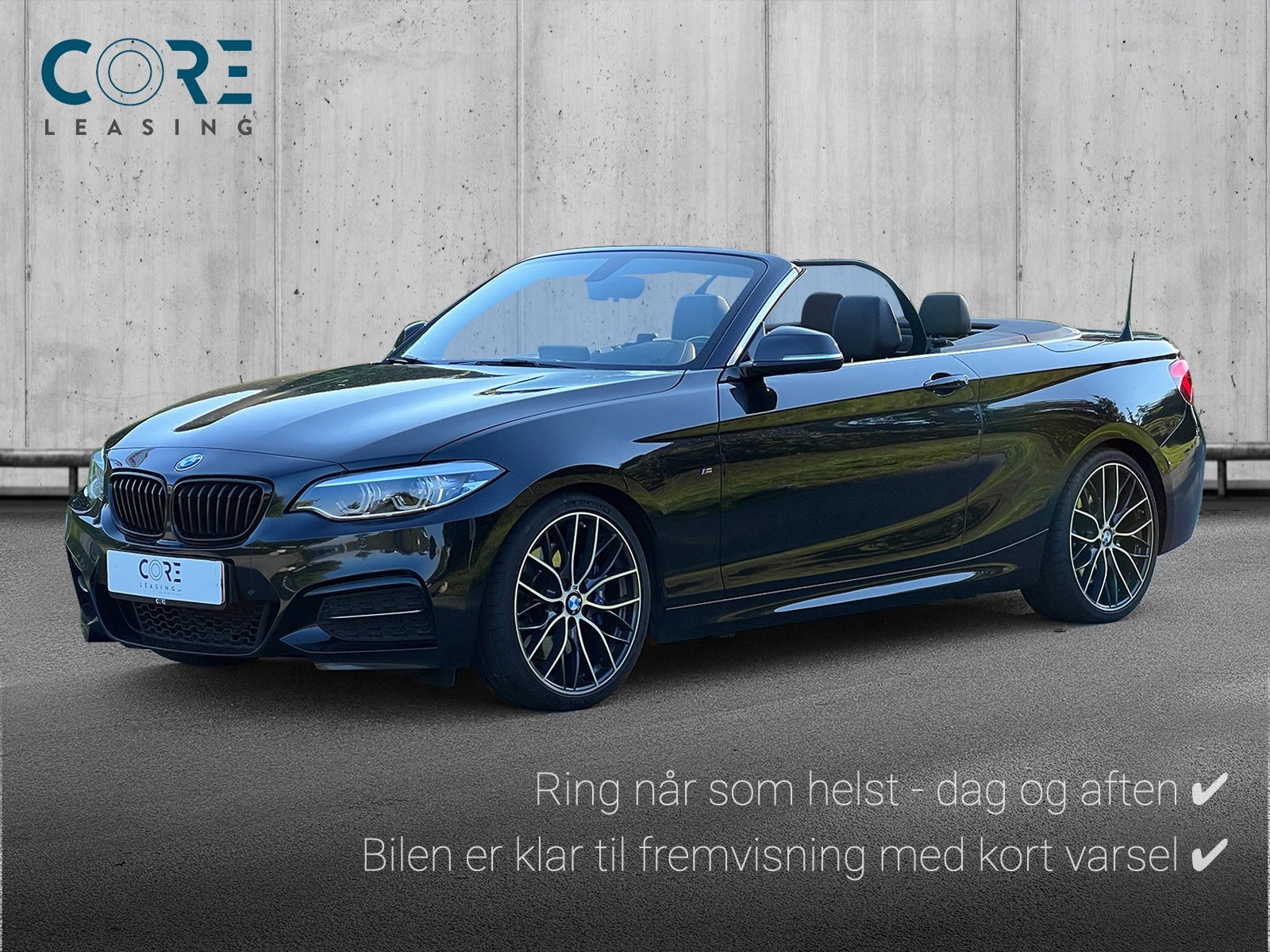 Sortmetal BMW M240i Cabriolet aut. fra 2017 parkeret foran en betonmur. CORE Leasing A/S er eksperter i BMW leasing.