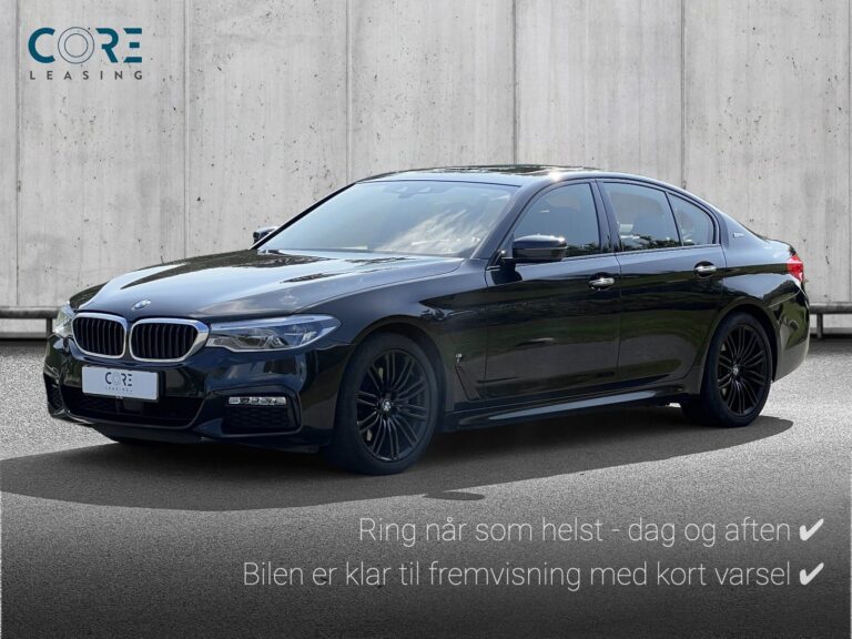 Gråmetal BMW 530e M-Sport aut. fra 2017 parkeret foran en betonmur. CORE Leasing A/S er eksperter i BMW leasing.